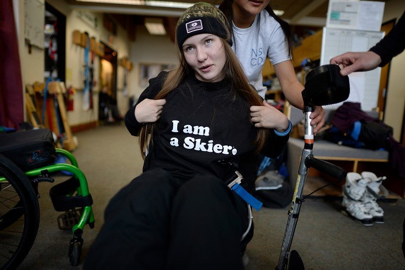 Kailyn Forsberg flaunts an "I am a Skier" shirt during her first day back on the snow since being paralyzed in a slopestyle skiing accident last year. Forsberg was photographed at Winter Park on Saturday, January 16, 2016. (Photo by AAron Ontiveroz/The Denver Post)
